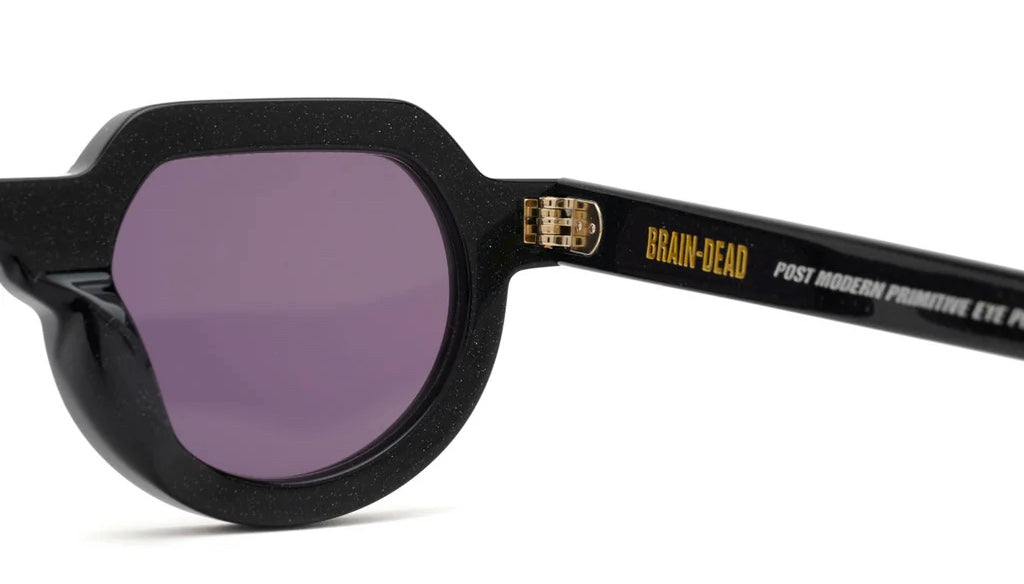 TANI POST MODERN PRIMITIVE EYE PROTECTION BLACK SPARKLE
